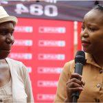 SPAR's National PR Director Mpudi Maubane interacts with one of the attendees of the Stokvel Talk in Vosloorus.