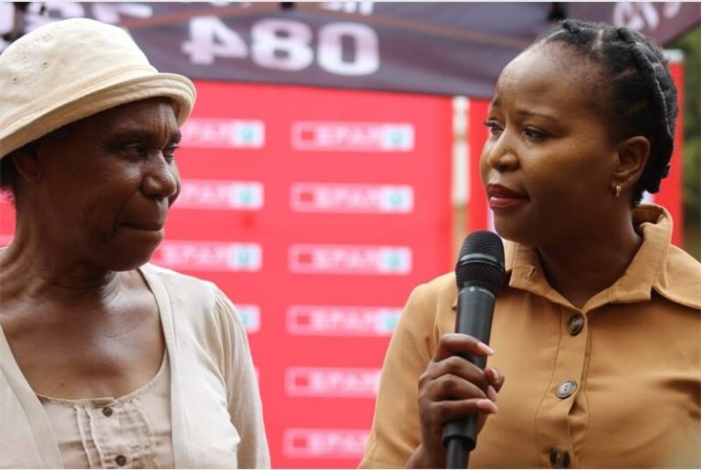 SPAR's National PR Director Mpudi Maubane interacts with one of the attendees of the Stokvel Talk in Vosloorus.